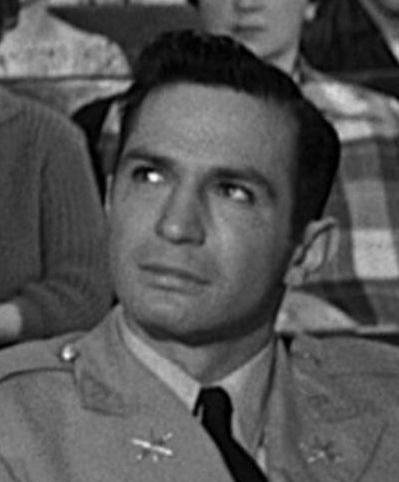 美国1959年奥托·普雷明格执导的电影《桃色血案》中角色,由本·戈扎