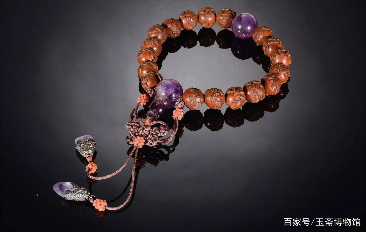 一颗橄榄核上能刻十六娃娃，被誉为中国神技，最贵的核雕作品_百科TA说