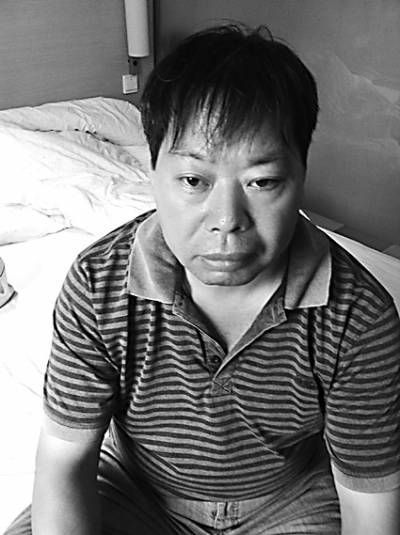 男,广西桂林司机,2011年2月,被指涉嫌"谋杀"阳朔县委书记谭峰被捕,而