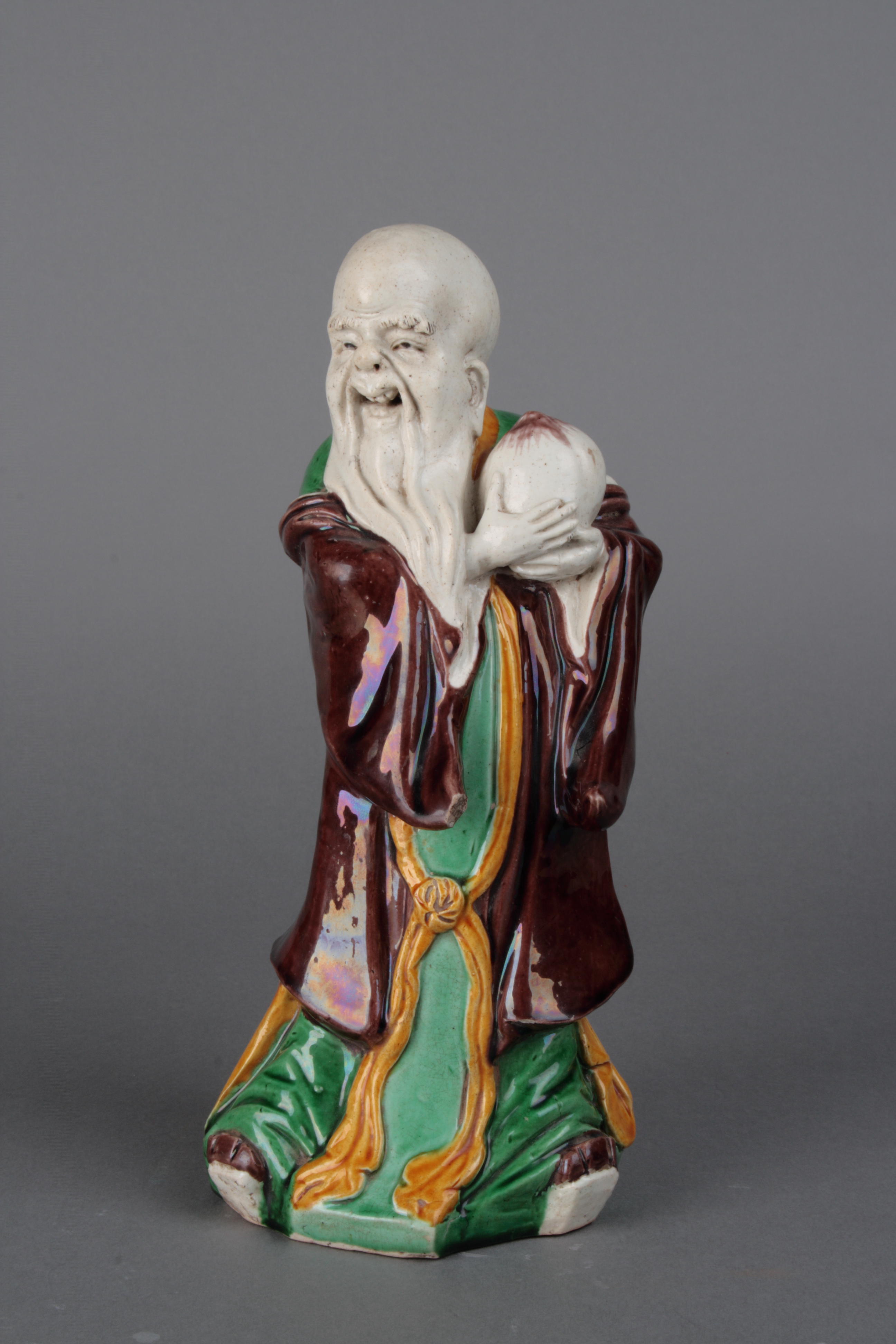 清康熙三彩寿星捧桃像