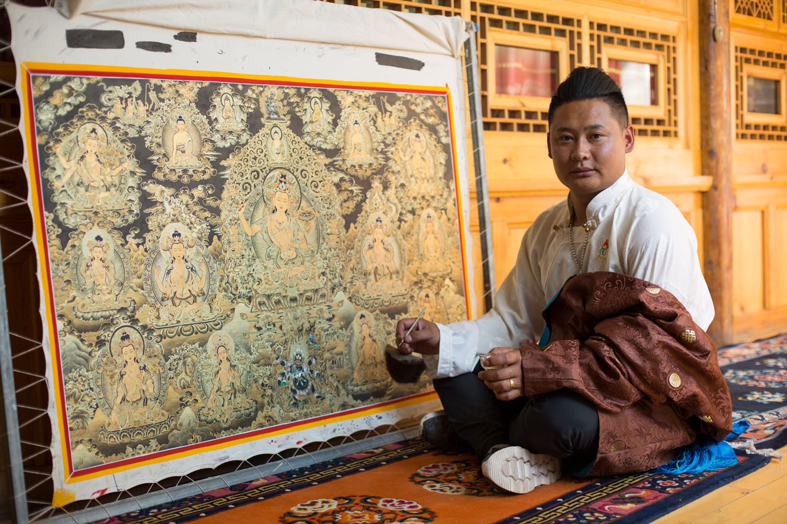  p>索南旦巴是一名唐卡画师 sup data-ctrid="236w8ufi">1 /sup> sup