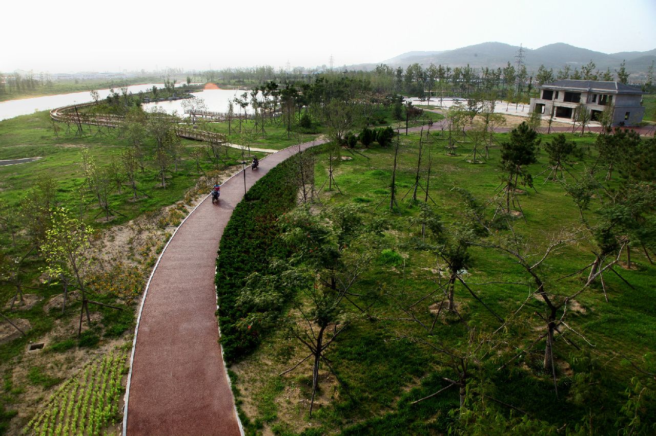  p data-id="gnzlmvviay">羊亭河湿地公园,位于山东省威海市环翠区