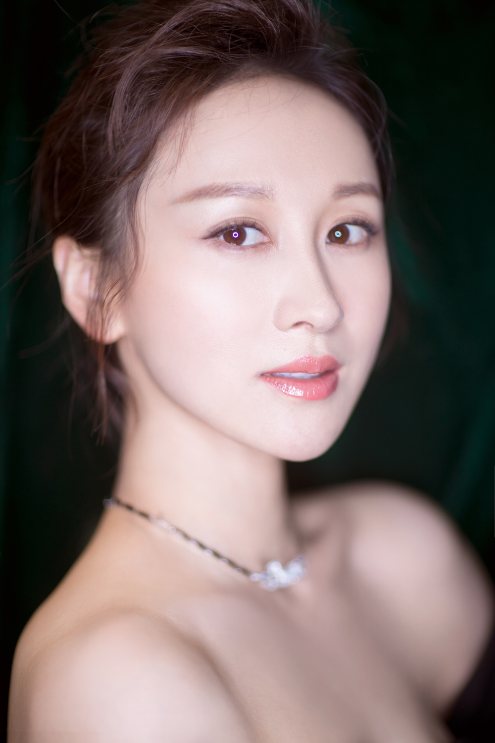 练束梅