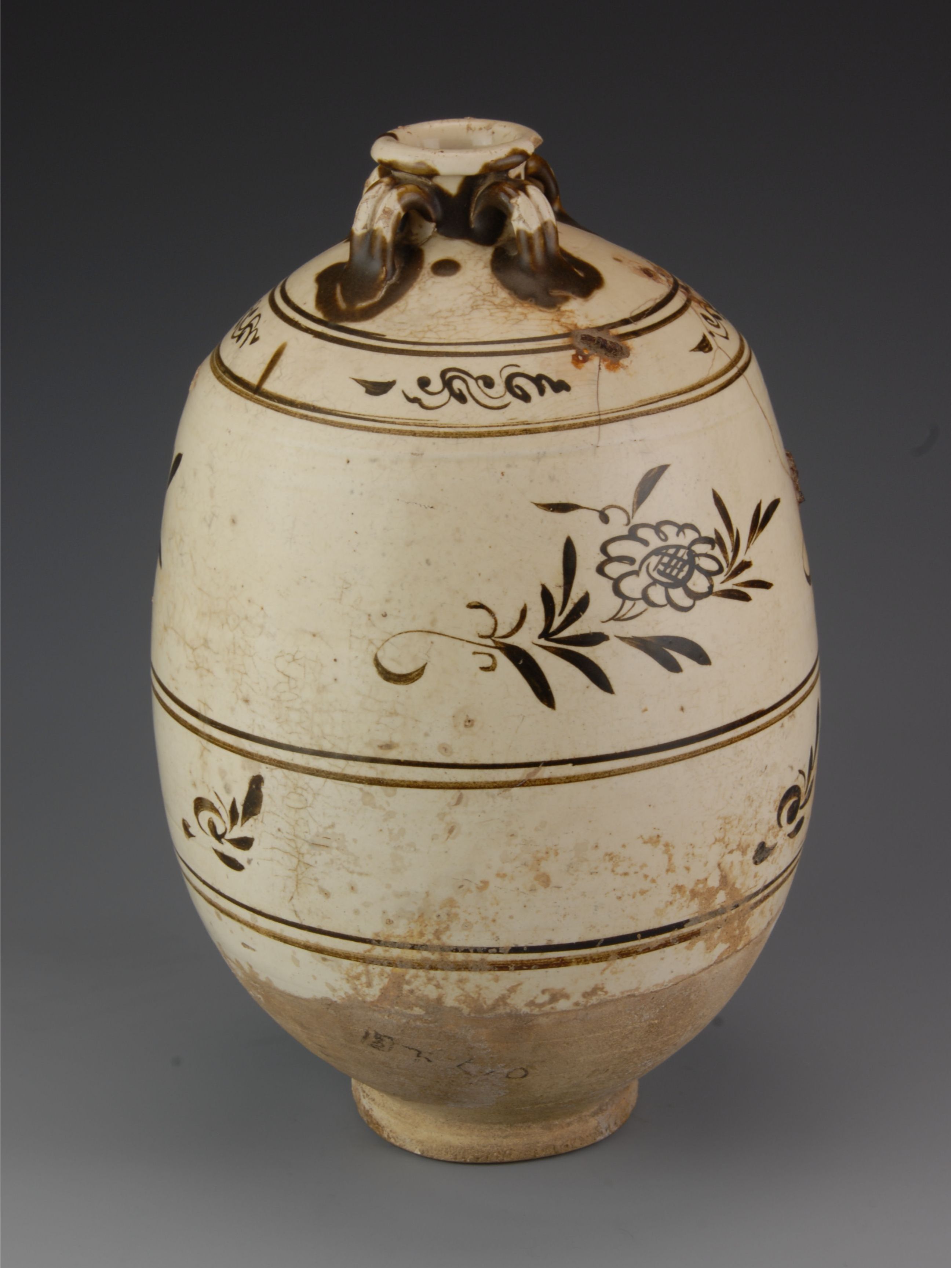 元磁州窑白釉褐花四系罐