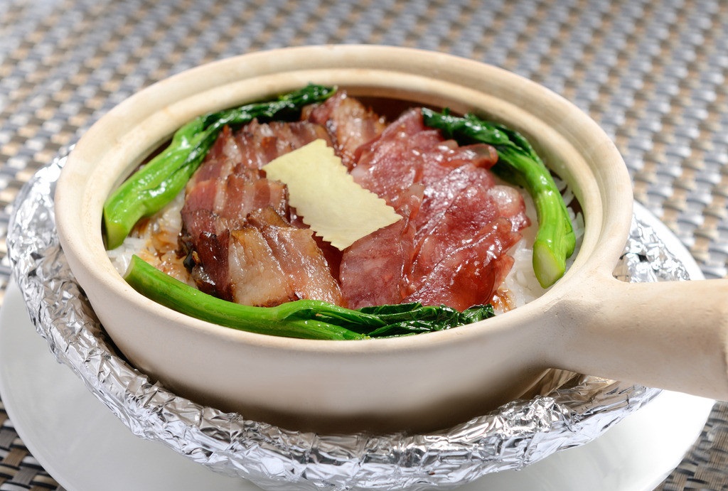  p>煲仔饭也称瓦煲饭,是广东省广州市的一道特色名菜,属于 a target="